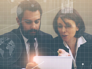People at a laptop with grid