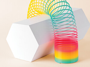 Flexible Multi Colored Coil Striding Hexagon Shape on White Background