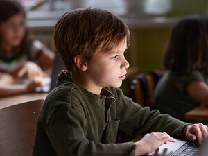 Students using computers in class