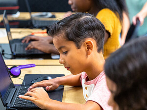 Students using tech in classroom