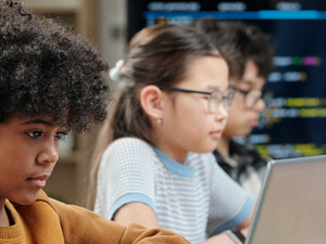Students using laptops in school