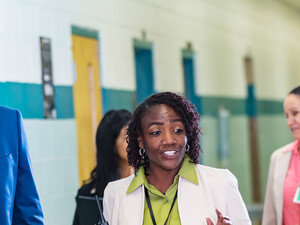 Diverse group of educators walking in hallway