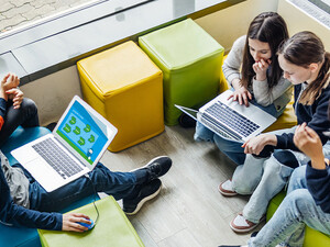 Students using computer in classroom