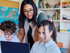 Students using computer in classroom