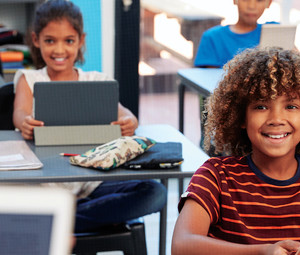 Students using tech in the classroom