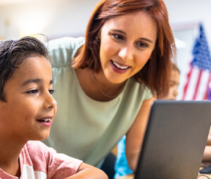 Teacher helping student 