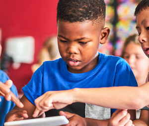 Teacher helping students