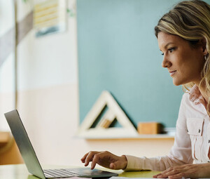 Teacher using laptop